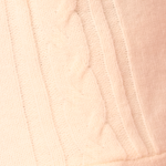 Pessoa usando Vestido Aiko creme ombro a ombro com detalhes em laço preto, meia-calça branca com padrão delicado, polainas brancas e sapatos Mary Jane creme, em frente a fundo rosa.